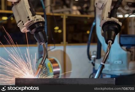Team robots welding assembly automotive part