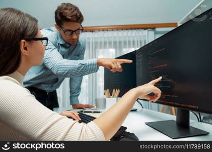 Team skilled developers program thinking newest coding creative website planning software project on two pc screen, comparing with typing full stack data analyzing prompt design at office. Postulate.. Team developers program thinking newest coding creative website. Postulate.