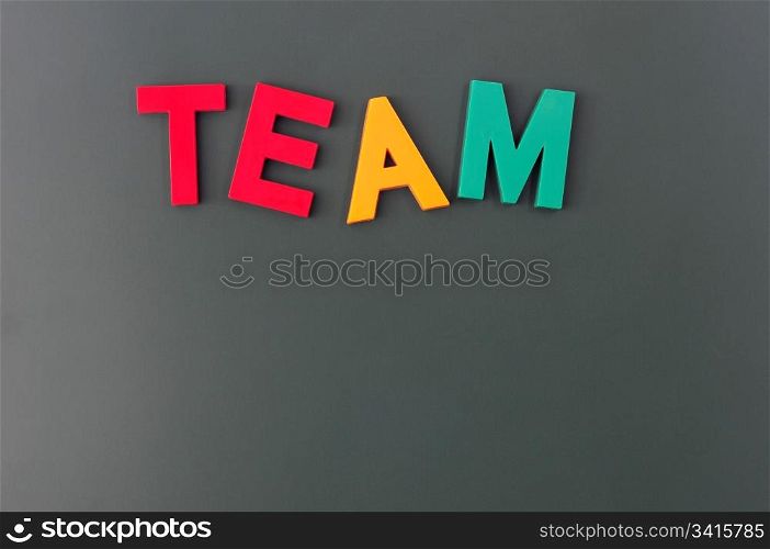 Team word made of colorful letters on a blackboard