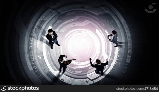 Team work concept. Top view of three business people in formal wear standing on digital floor