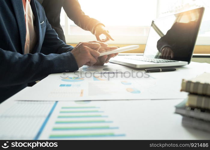 Team work process. business managers crew working with new startup project. labtop,tablet on wood table in office.