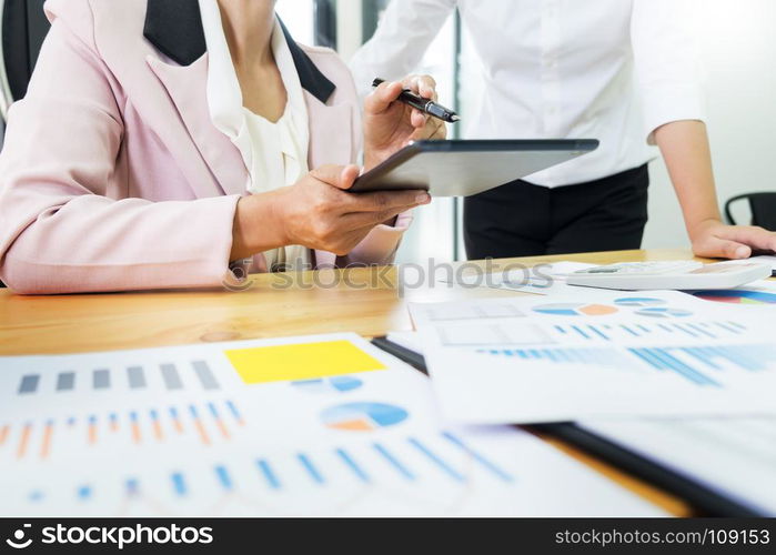 Team work process. young business managers crew working with new startup project. laptop on wood table, typing keyboard, texting message, analyze graph plans