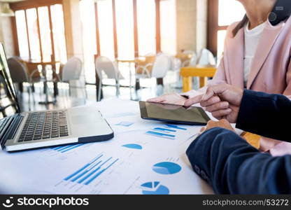 Team work process. young business managers crew working with new startup project. labtop on wood table, typing keyboard, texting message, analyse graph plans