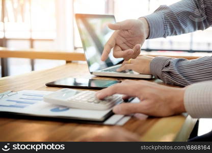 Team work process. young business managers crew working with new startup project. laptop on wood table, typing keyboard, texting message, analyze graph plans.