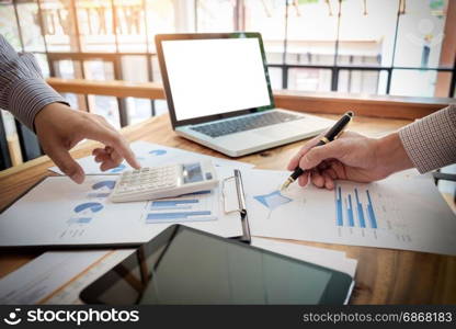 Team work process. young business managers crew working with new startup project. laptop on wood table, typing keyboard, texting message, analyze graph plans.