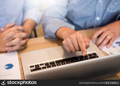 Team work process. young business managers crew working with new startup project. laptop on wood table, typing keyboard, texting message, analyze graph plans