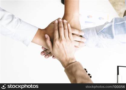 Team work with hands together. Cooperate concept
