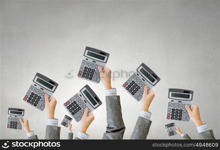 Teamwork and collaboration concept. Many hands of business people holding calculators