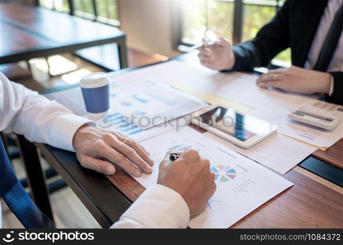 teamwork company meeting concept, business partners working with laptop computer together analysing startup financial project result or strategy plan and discussing data document in office