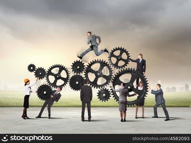 Teamwork concept. Conceptual image of businessteam working cohesively. Interaction and unity