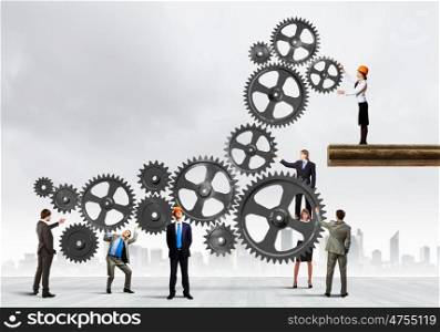 Teamwork concept. Conceptual image of businessteam working cohesively. Interaction and unity