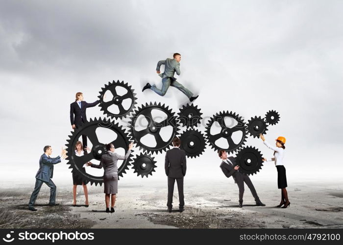 Teamwork concept. Conceptual image of businessteam working cohesively. Interaction and unity