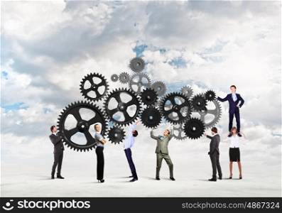 Teamwork concept. Conceptual image of businessteam working cohesively. Interaction and unity