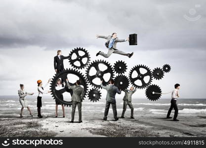 Teamwork concept. Conceptual image of businessteam working cohesively. Interaction and unity