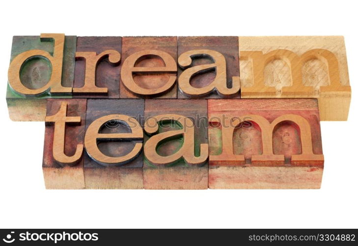 teamwork concept - dream team words in vintage wooden letterpress printing blocks, stained by color inks, isolated on white