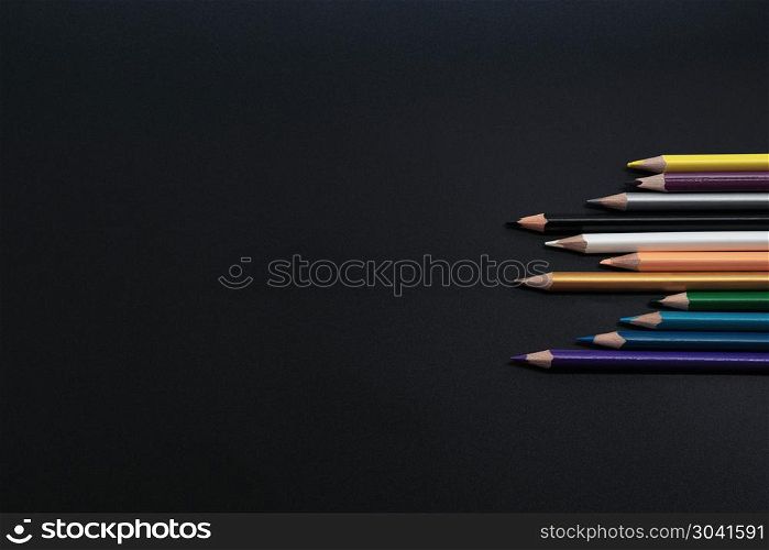 Teamwork concept. group of color pencil on black background