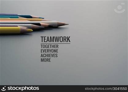 Teamwork concept. group of color pencil on black background with. Teamwork concept. group of color pencil on black background with word Teamwork, Together, Everyone, Achieves and More