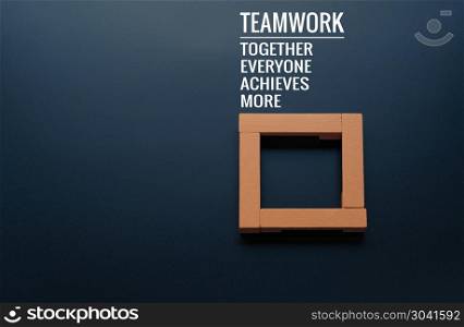 Teamwork concept. group of wooden square on the black background. Teamwork concept. group of wooden square on the black backgrounds with word Teamwork, Together, Everyone, Achieves and More