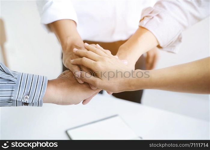 Teamwork concept, People putting hands together.