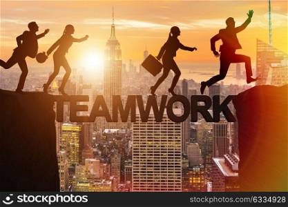 Teamwork concept with business people crossing bridge