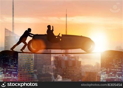 Teamwork concept with businessman pushing car