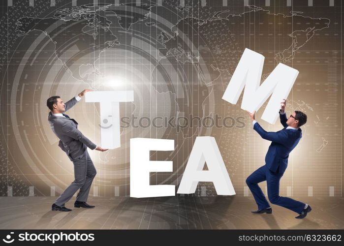 Teamwork concept with businessman putting letters