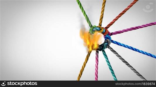 Teamwork crisis and disconnect concept as a business metaphor for losing a partnership as diverse ropes connected together being torn apart with burning flames as a corporate symbol for cooperationwith 3D render elements.
