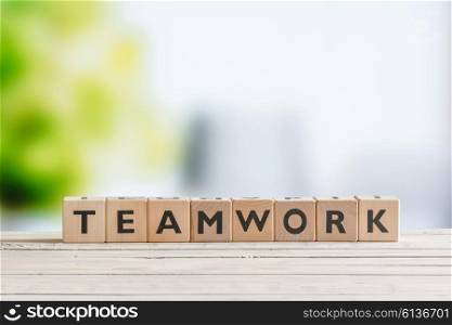 Teamwork message made of cubes on a table