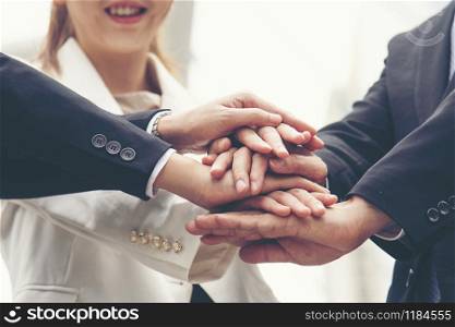 Teamwork Together Concept. Group of diversity people high five on air to greeting power of tag team. Multiethnic people group working togetherness. Volunteer collaboration in Business Team success