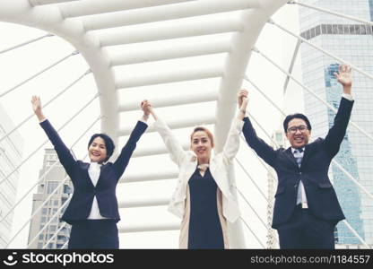 Teamwork Together Concept. Group of diversity people high five on air to greeting power of tag team. Multiethnic people group working togetherness. Volunteer collaboration in Business Team success