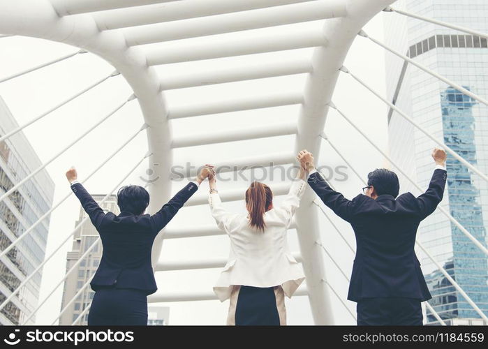 Teamwork Together Concept. Group of diversity people high five on air to greeting power of tag team. Multiethnic people group working togetherness. Volunteer collaboration in Business Team success