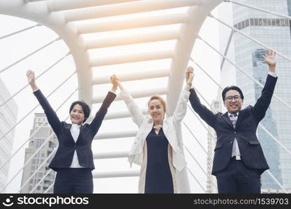 Teamwork Together Concept. Group of diversity people high five on air to greeting power of tag team. Multiethnic people group working togetherness. Volunteer collaboration in Business Team success