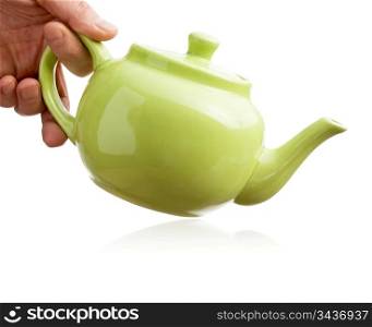 teapot in hand isolated on white background