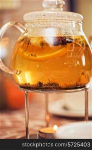 teapot of herbal tea on table