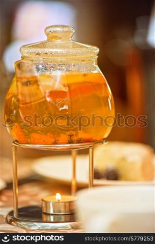 teapot of herbal tea on table . teapot of herbal tea