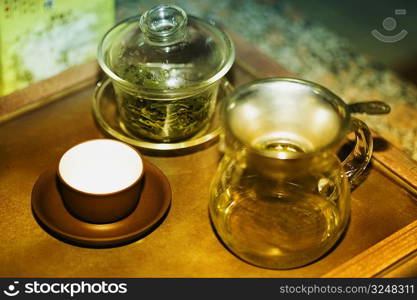 Teapot with a tea cup and a jar on a table, Qingdao, Shandong Province, China