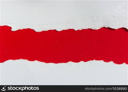 tear red paper pieces of paper on white background