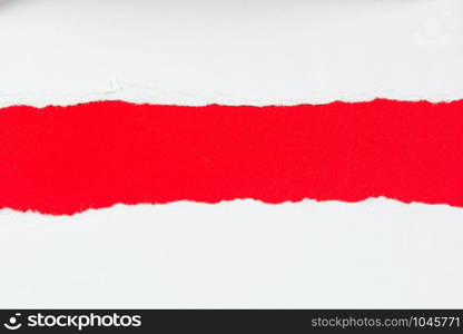 tear red paper pieces of paper on white background