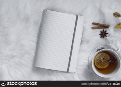 teatime with opened blank notebook