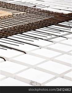 Technical detail of building operations: floor. Materials: polystyrene, steel bars, concrete