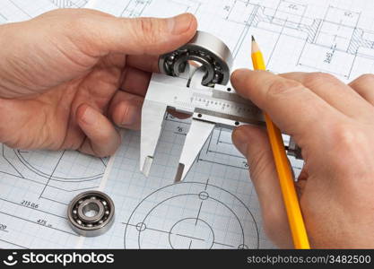 technical drawing and tools in hand