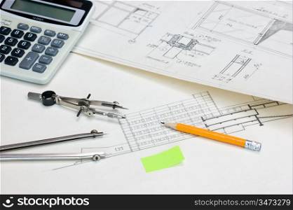 technical drawings and a calculator