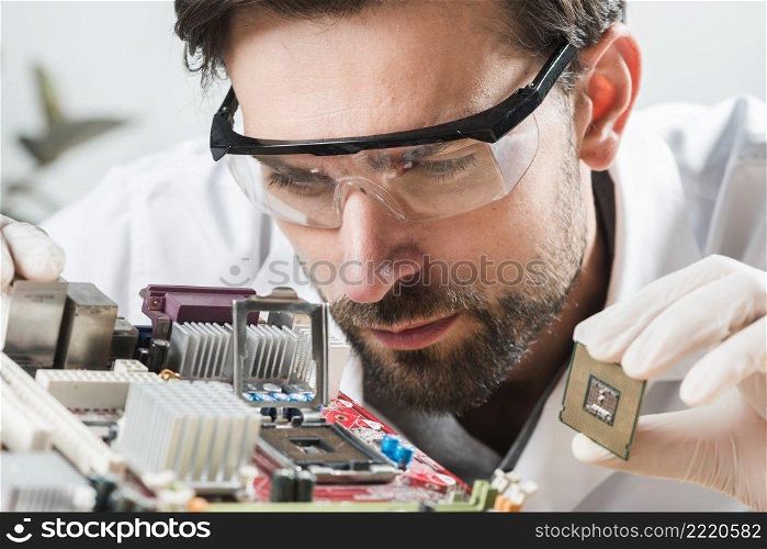 technician checking microchip slot computer motherboard