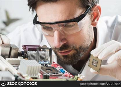 technician checking microchip slot computer motherboard