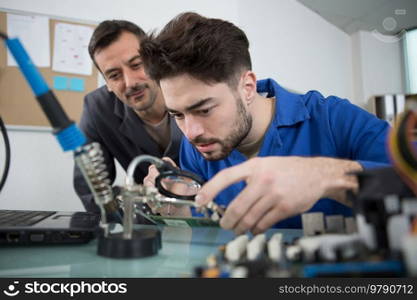 technician fitting component into computer