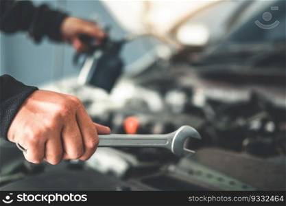 Technician Hands of car mechanic working in auto repair Service and Maintenance car