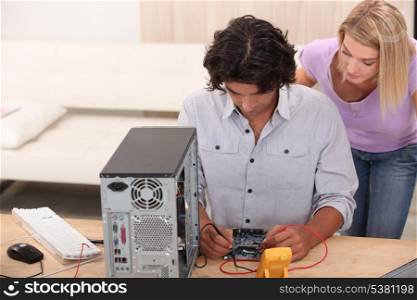 technician repairing a computer