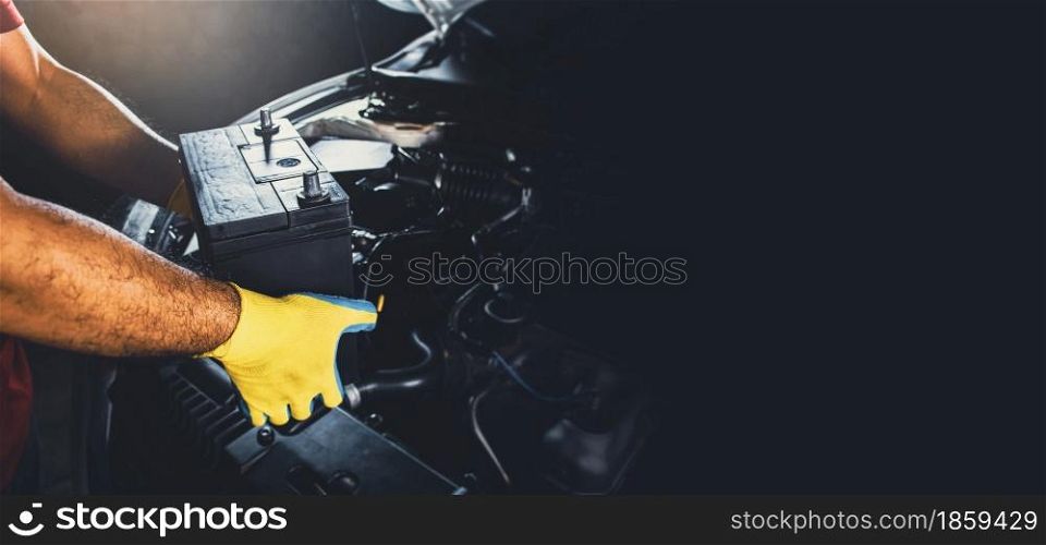 Technician replaced new battery of the car with copy space
