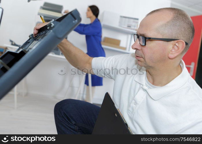 technician specializes in a large printer