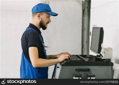 technician typing keyboard garage